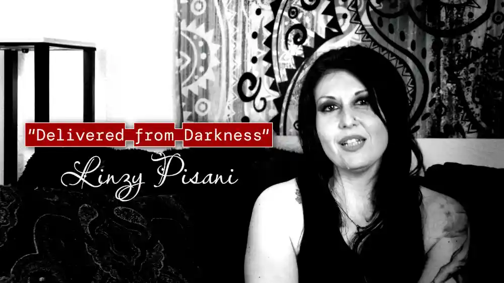 A woman sitting on a couch with the title Delivered from Darkness: Linzy's Story
